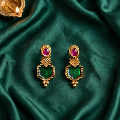 Emerald green and ruby stone gold finish jhumka earrings